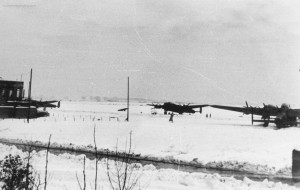 Waddington Lancasters in the snow, February 1944. Photograph taken by the Station medical Officer, Flight Lieutenant Howarth. The control tower is visible at the left of shot. From the Waddington Collection, RAF Waddington heritage Centre